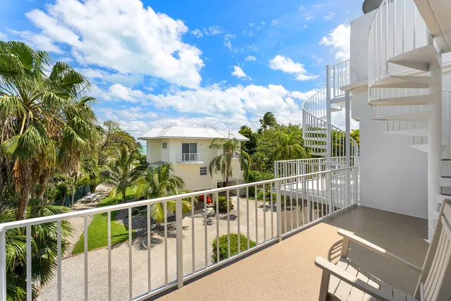 a view of a balcony with wooden floor