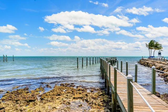 a view of a balcony with floor to ceiling windows