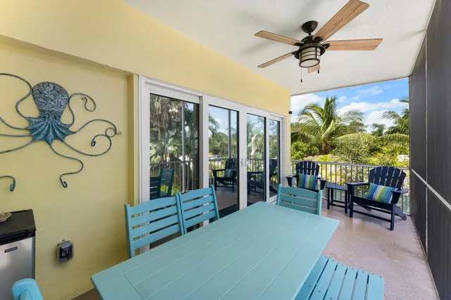 a bedroom with furniture and a large window