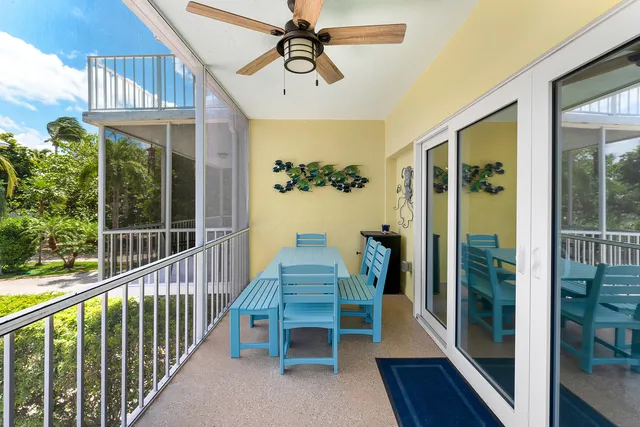 a view of a balcony with furniture