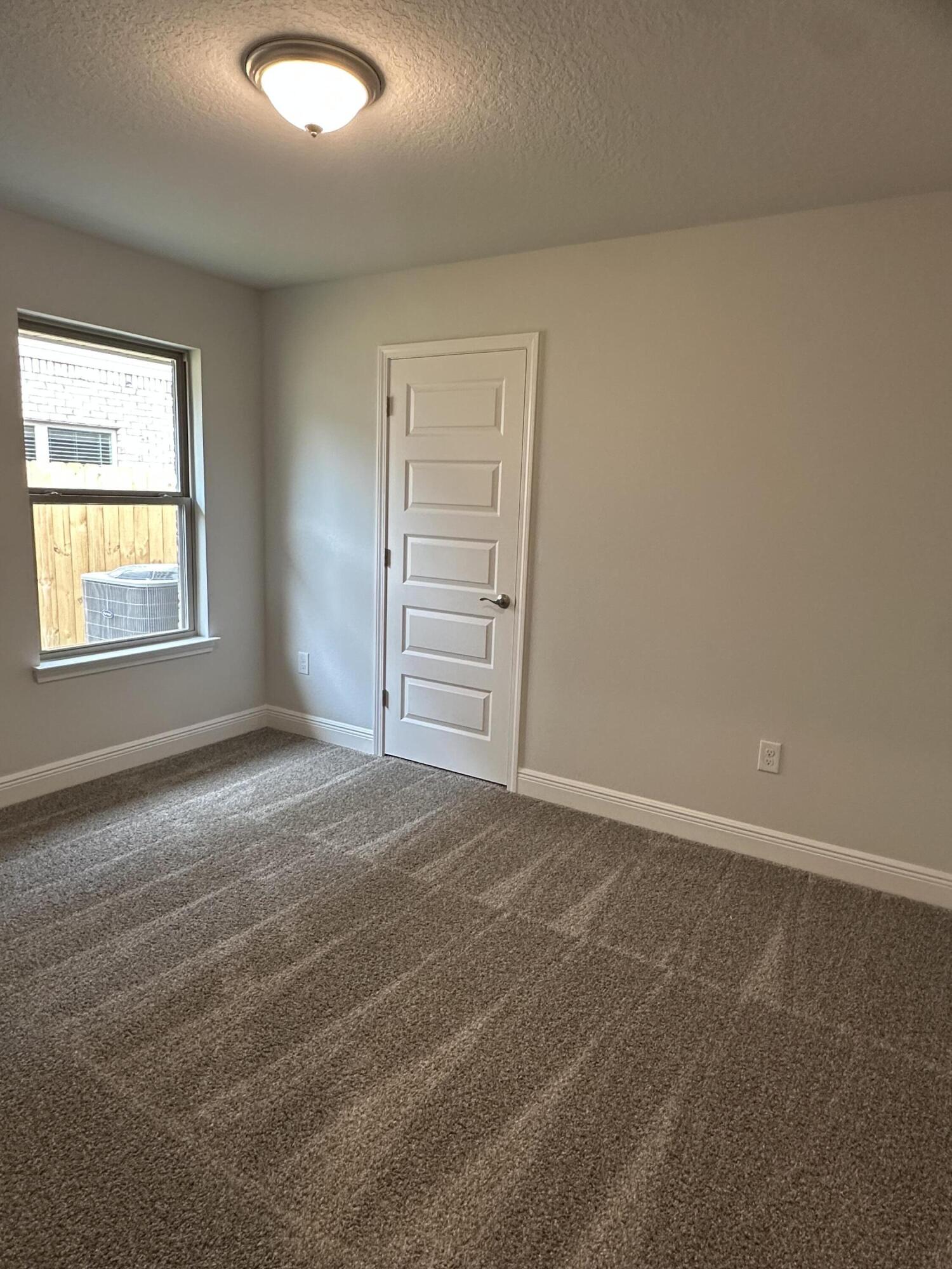 191 Ridgeway Circle Crestview, FL 32536 - Photo 14 of 26 an empty room with windows and closet