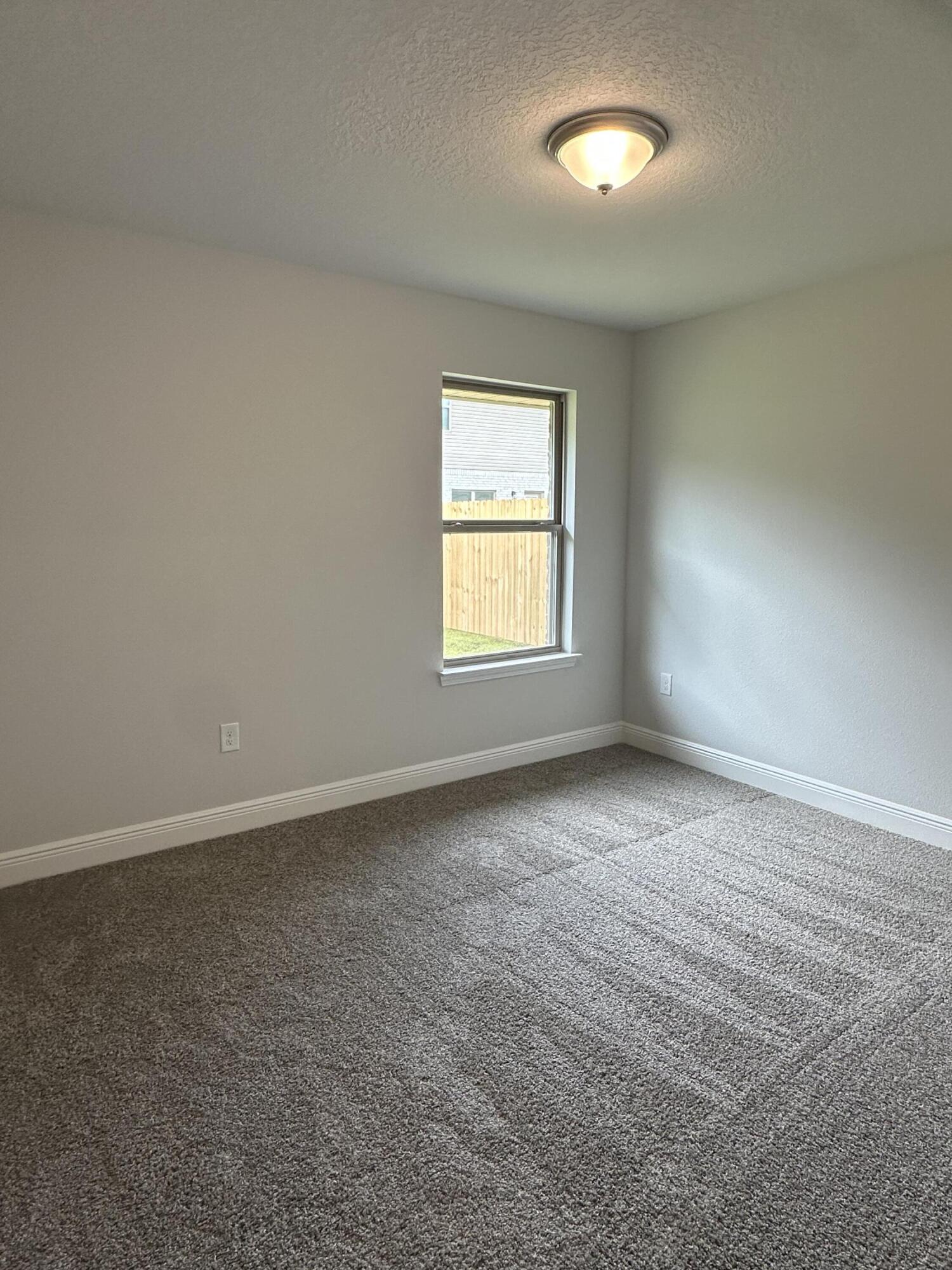 191 Ridgeway Circle Crestview, FL 32536 - Photo 16 of 26 an empty room with a window