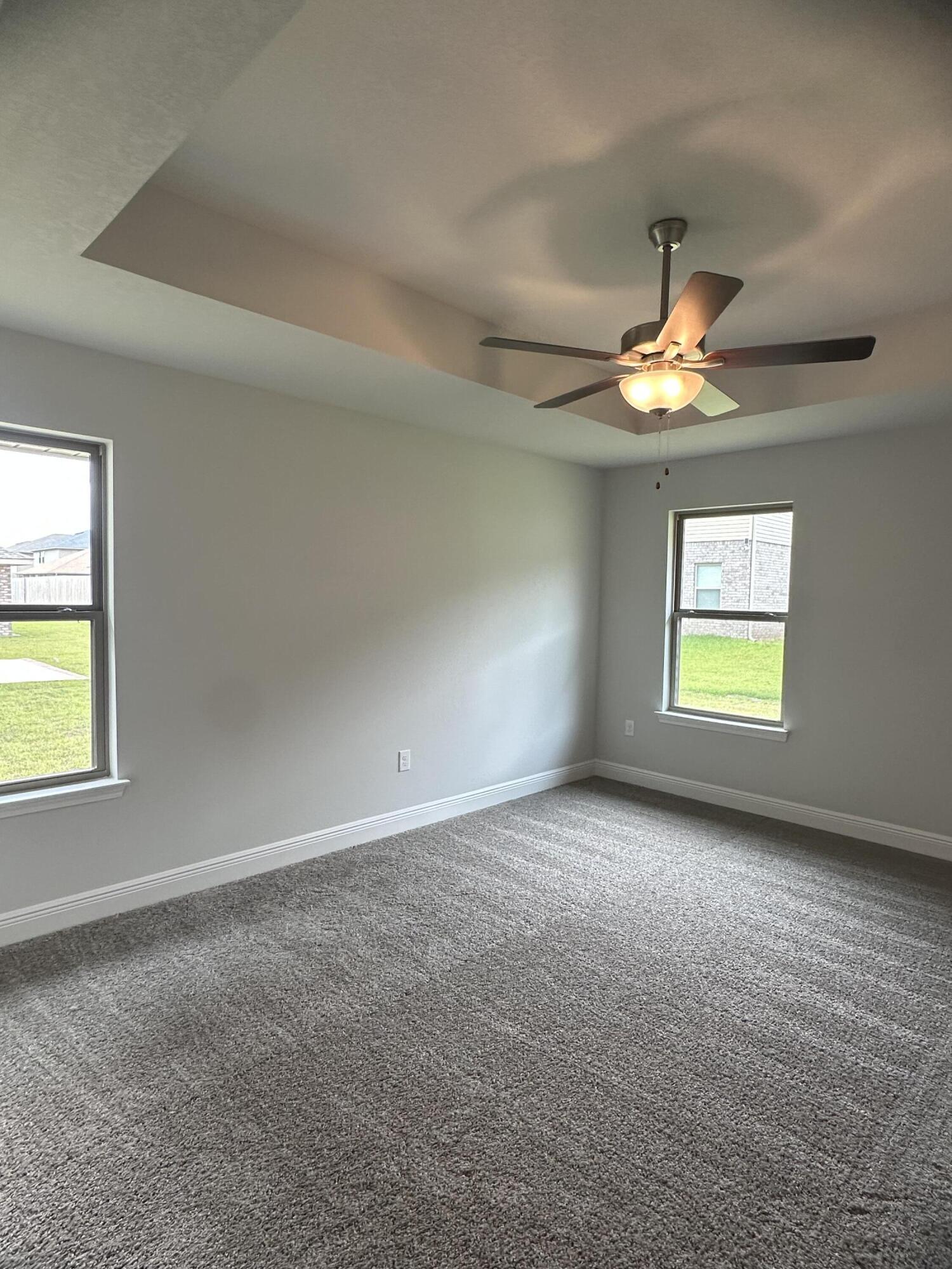 191 Ridgeway Circle Crestview, FL 32536 - Photo 17 of 26 an empty room with windows and fan