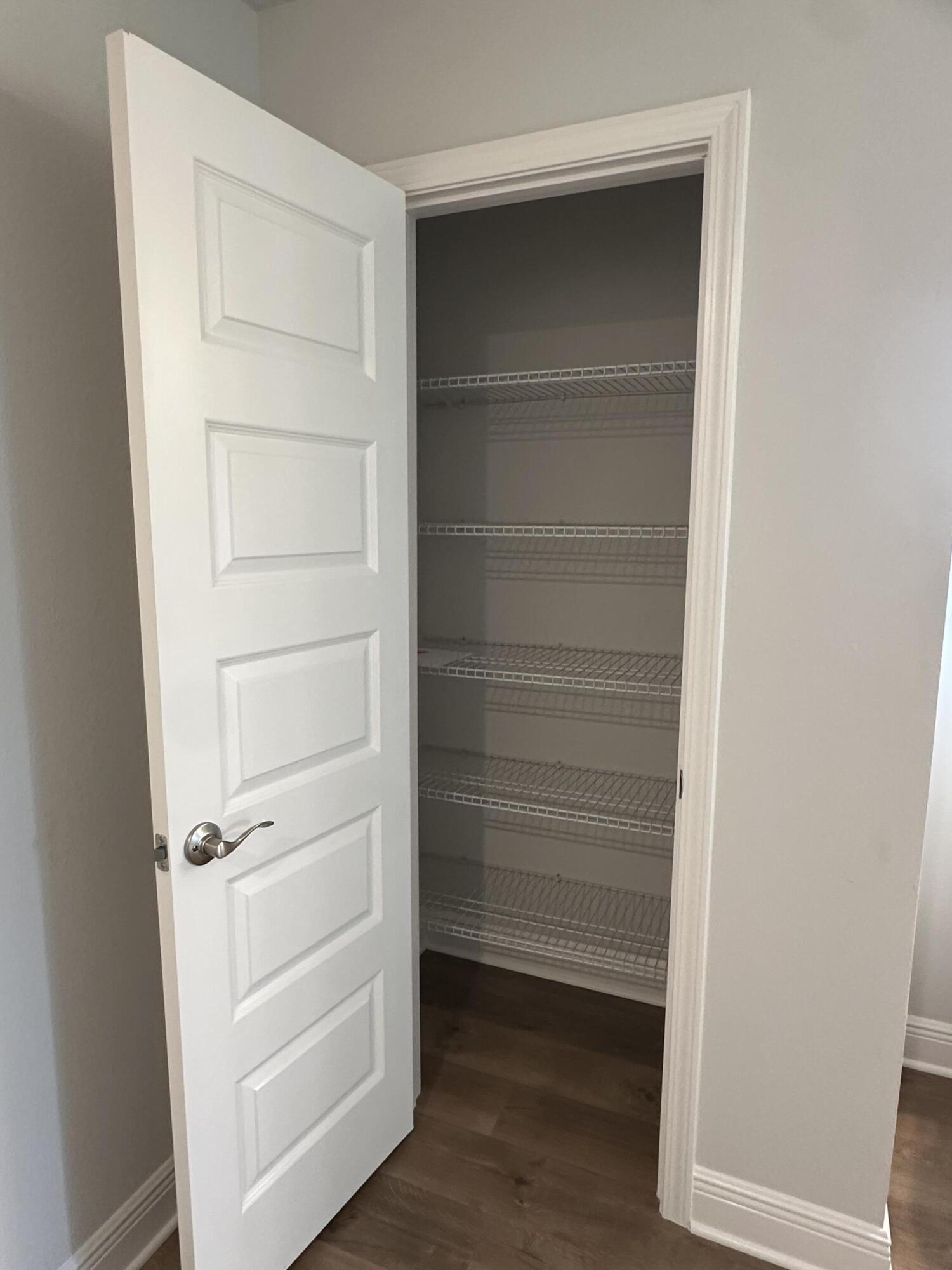 191 Ridgeway Circle Crestview, FL 32536 - Photo 20 of 26 a view of walk in closet with empty racks