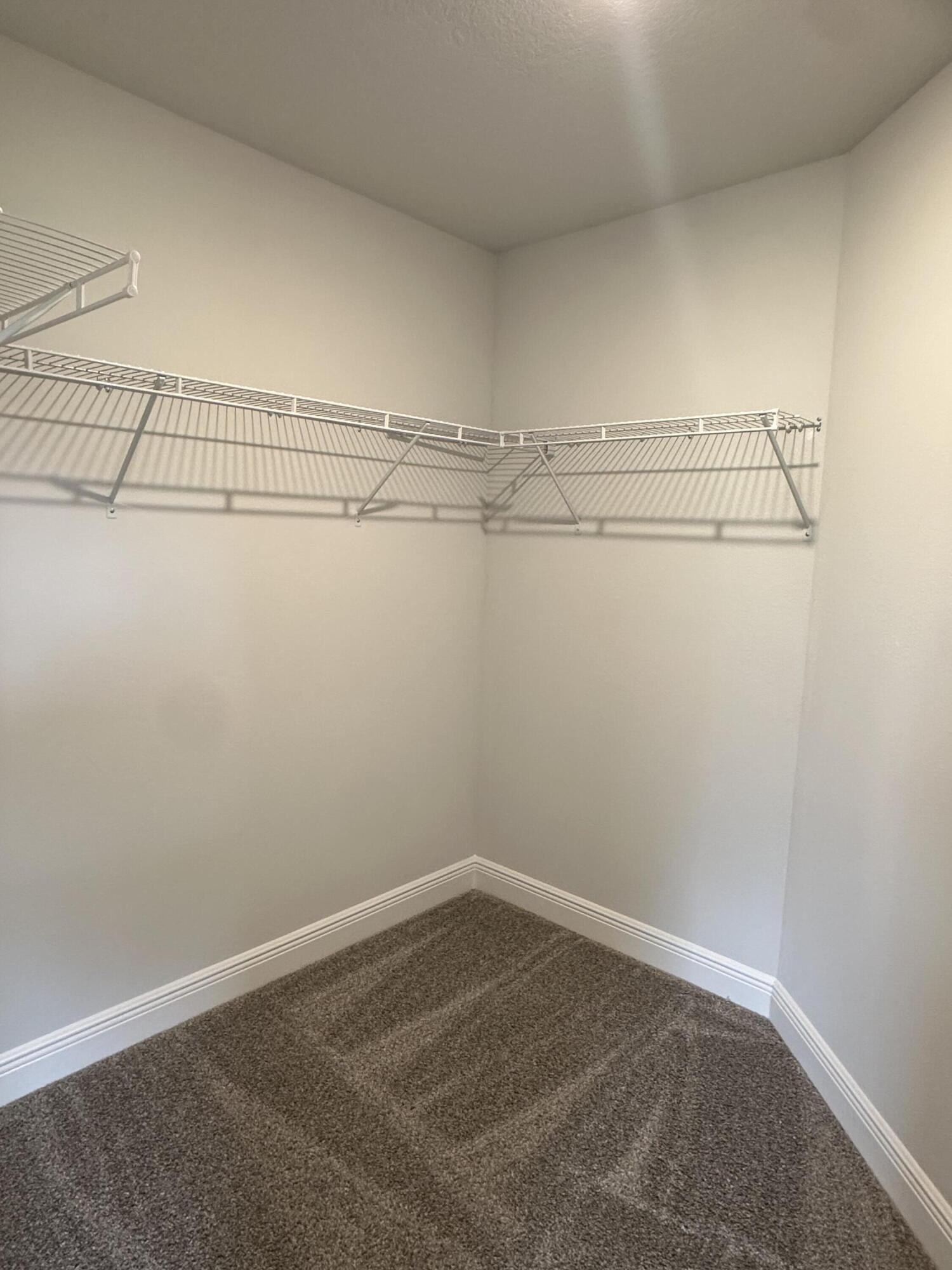 191 Ridgeway Circle Crestview, FL 32536 - Photo 22 of 26 a view of a room with racks on the wall