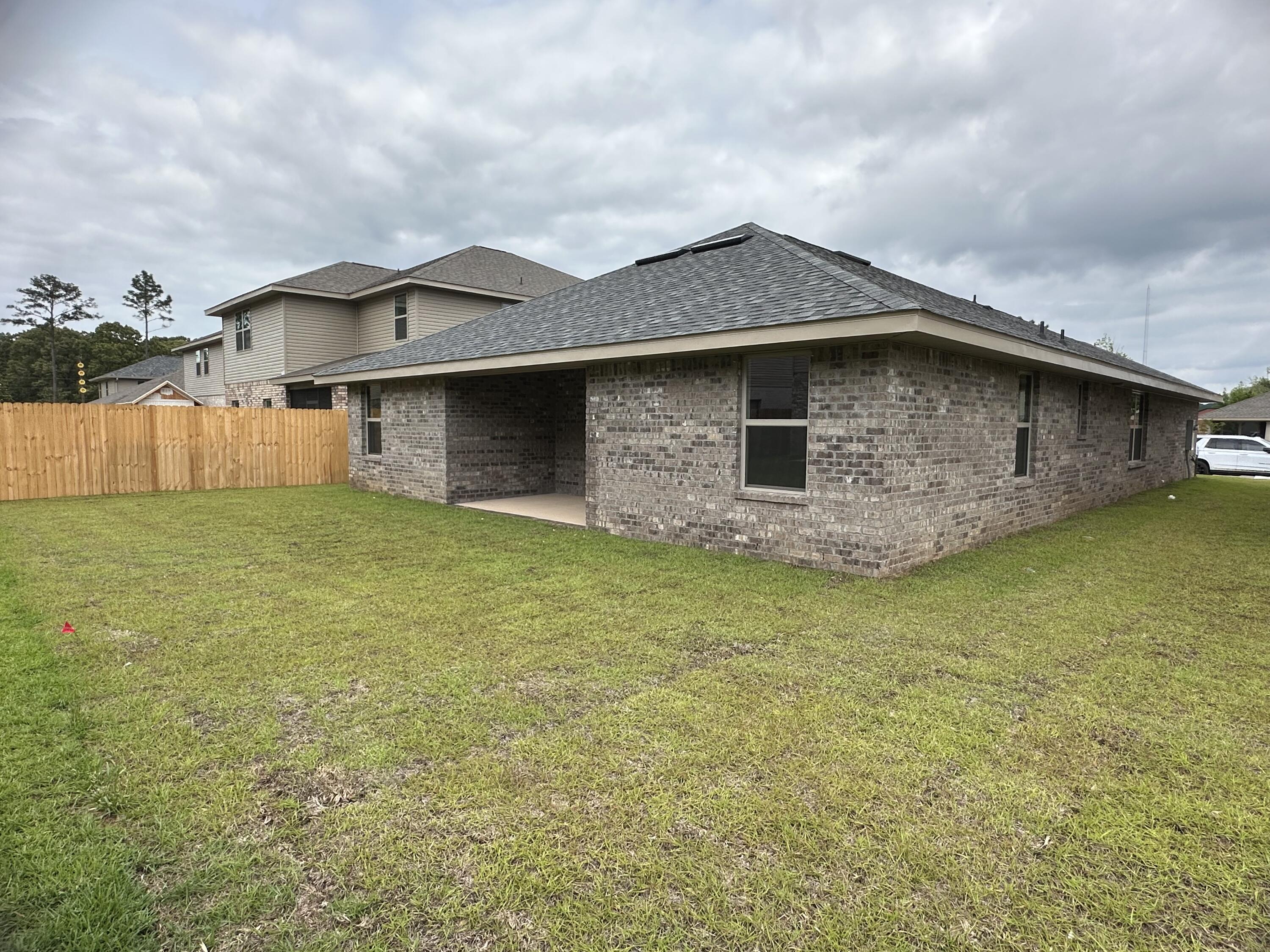 191 Ridgeway Circle Crestview, FL 32536 - Photo 23 of 26 a front view of a house with a yard