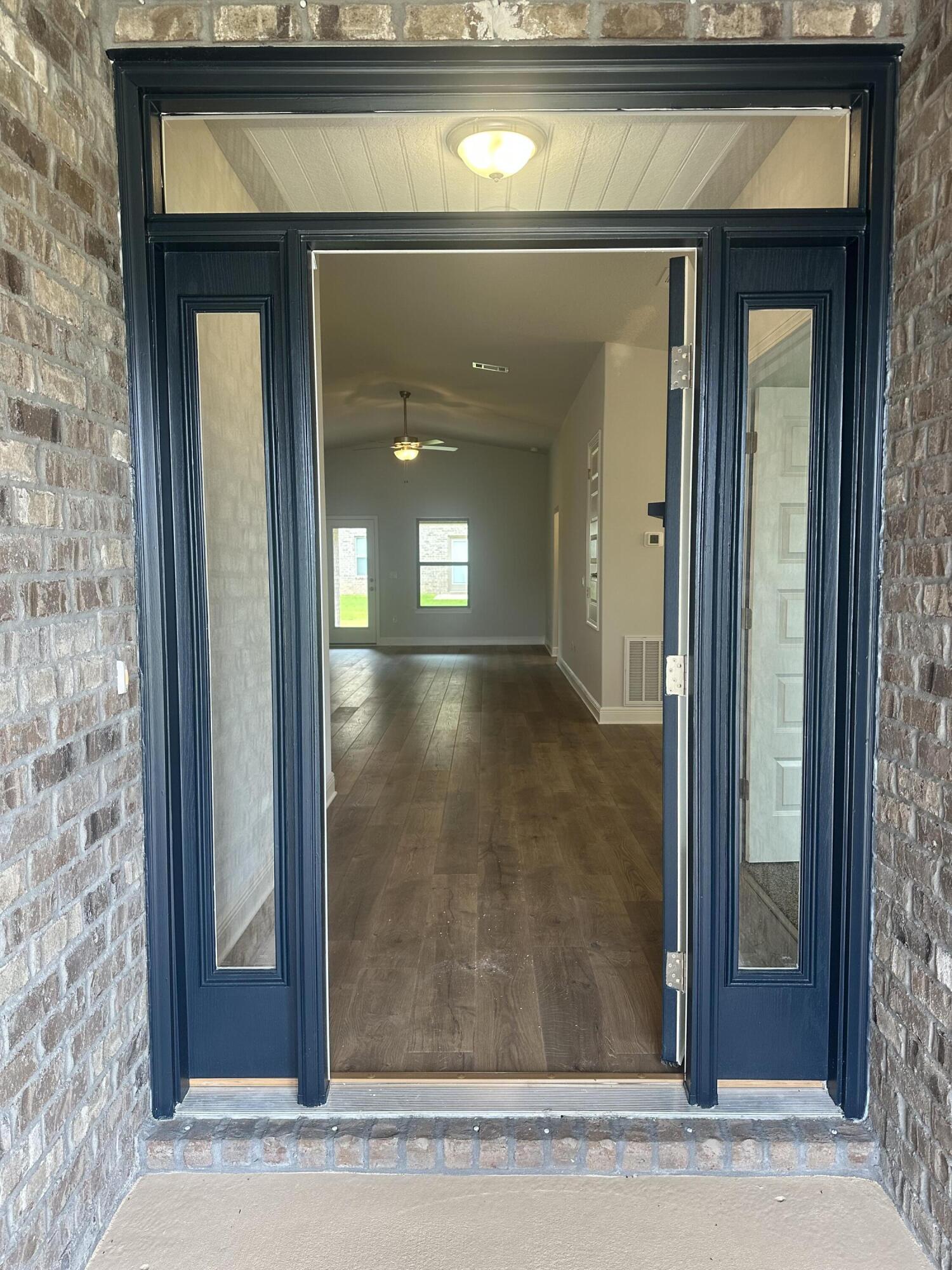 191 Ridgeway Circle Crestview, FL 32536 - Photo 3 of 26 a view of a hallway with wooden floor