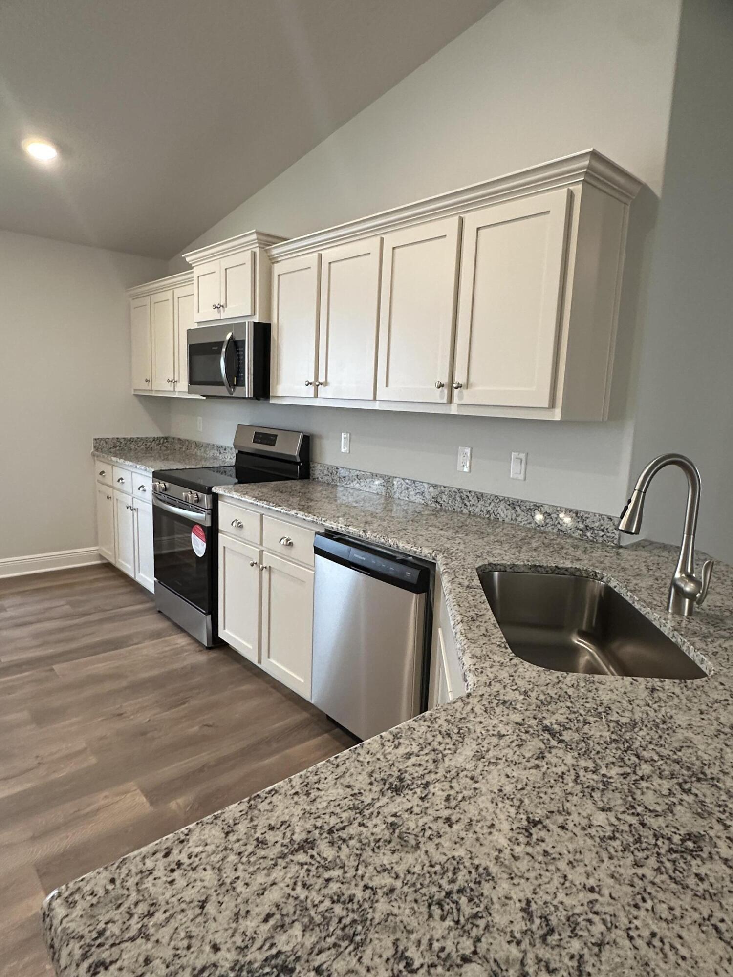 191 Ridgeway Circle Crestview, FL 32536 - Photo 10 of 26 a kitchen with granite countertop a sink stainless steel appliances and cabinets