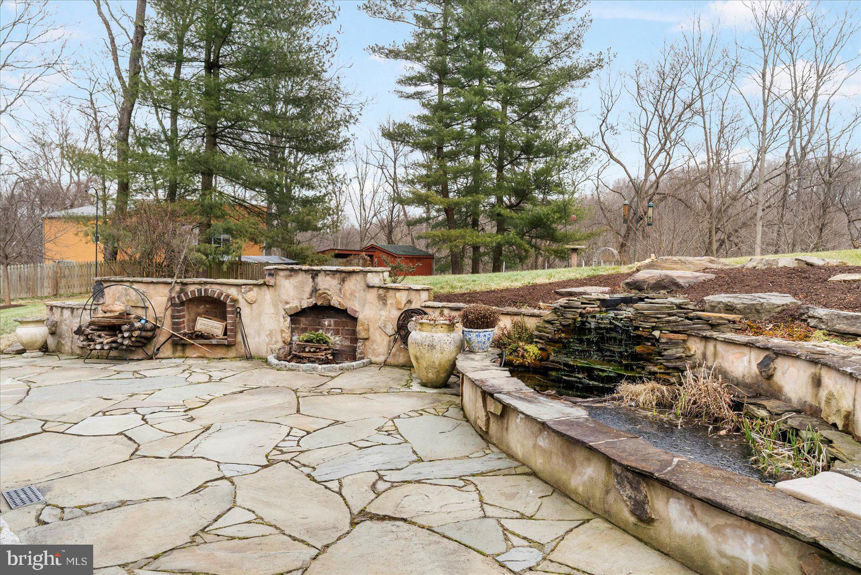 14411 Falls Road Cockeysville, MD 21030 - Photo 18 of 89 Stone Patio with Goldfish Pond & Waterfall