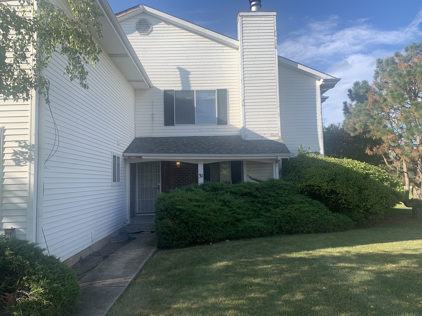31 Churn Road Matteson, IL 60443 - Photo 2 of 10 a front view of a house with a garden