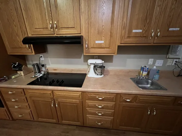 a kitchen with a sink and cabinets
