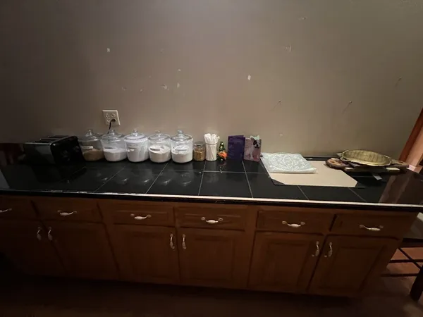 a kitchen with a sink and cabinets