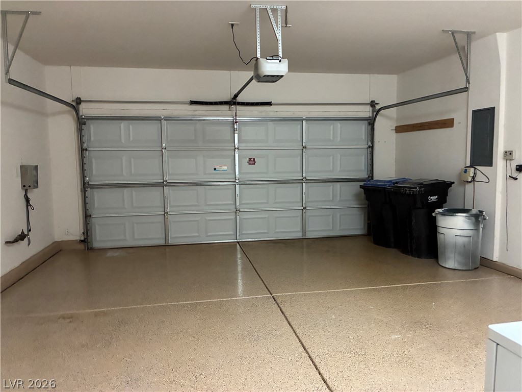 2523 Romanza Road Henderson, NV 89052 - Photo 8 of 24 Ample garage space provides convenience and secure parking for vehicles.