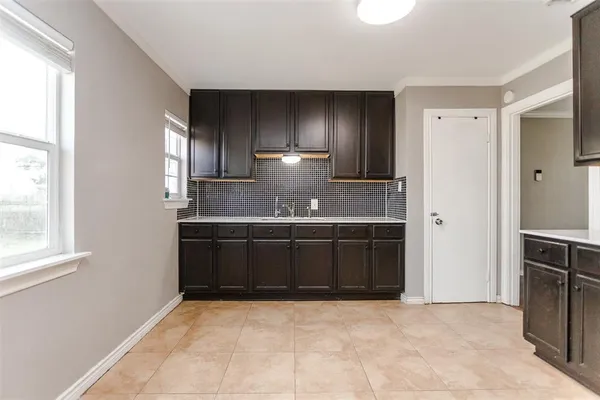 a bathroom with a sink and a large mirror