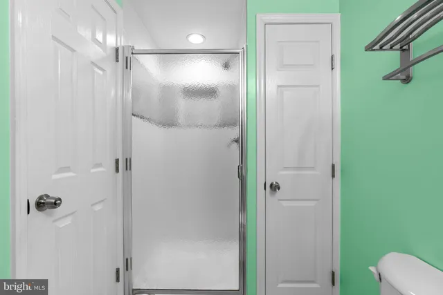 a view of deck with two chairs and wooden fence