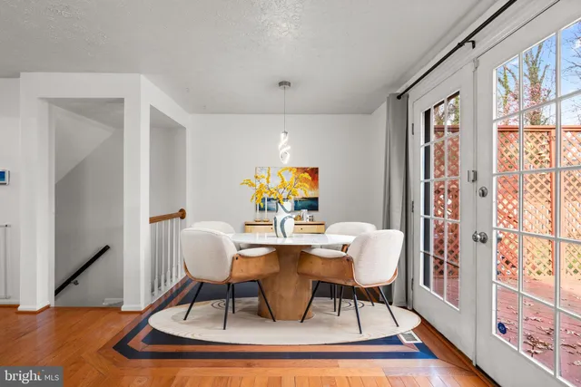 a kitchen with white cabinets and appliances