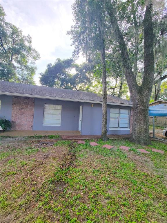 5338 Orange Avenue, Unit B Seffner, FL 33584 - Photo 1 of 8 a backyard of a house with lots of green space
