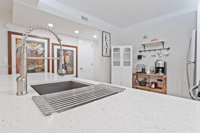 a bedroom with furniture and a flat screen tv