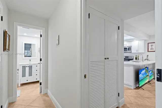 a view of kitchen with white cabinets