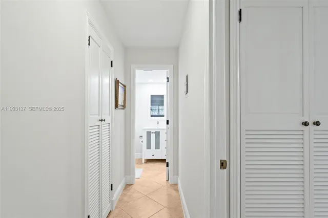 a view of a bathroom with a shower and a door
