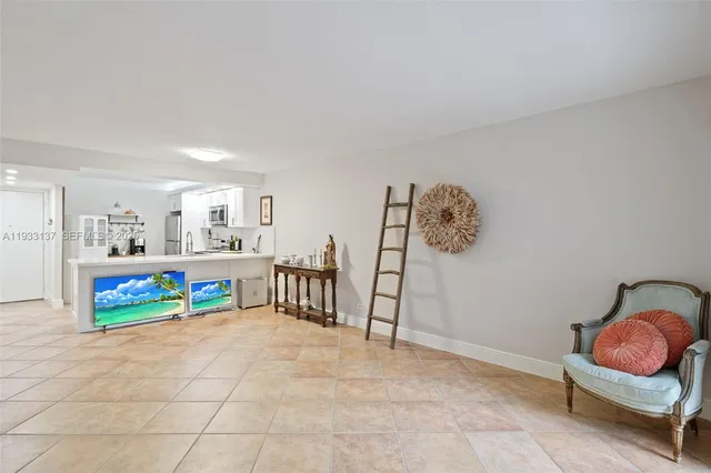 a bedroom with furniture and a rug