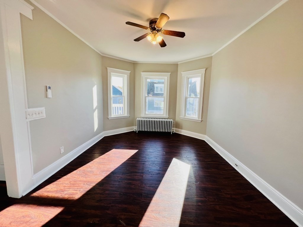 22 Gardena Street, Unit 3 Boston, MA 02135 - Photo 14 of 17 a view of room with window and wooden floor