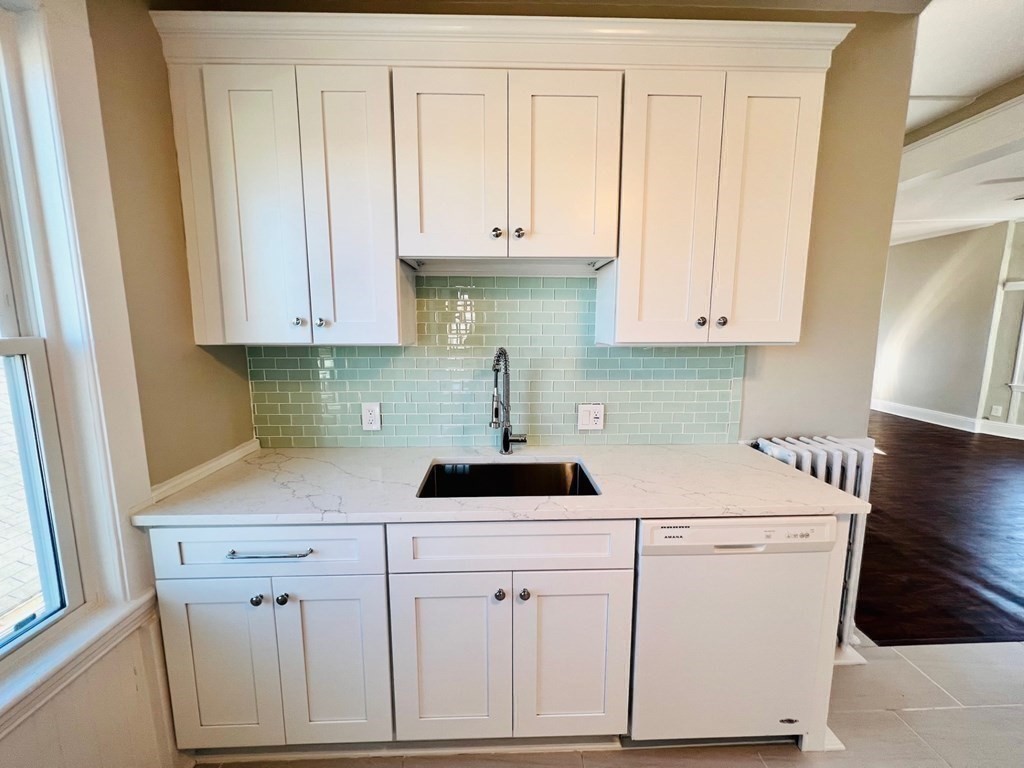22 Gardena Street, Unit 3 Boston, MA 02135 - Photo 7 of 17 a kitchen with white cabinets