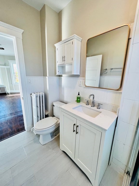 22 Gardena Street, Unit 3 Boston, MA 02135 - Photo 9 of 17 a bathroom with a sink toilet and mirror