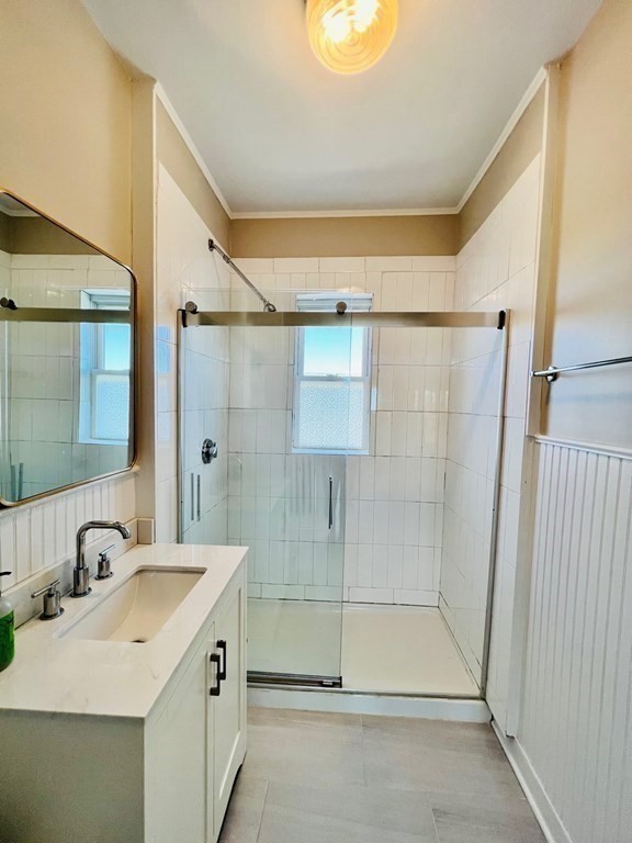 22 Gardena Street, Unit 3 Boston, MA 02135 - Photo 10 of 17 a bathroom with a shower sink and mirror