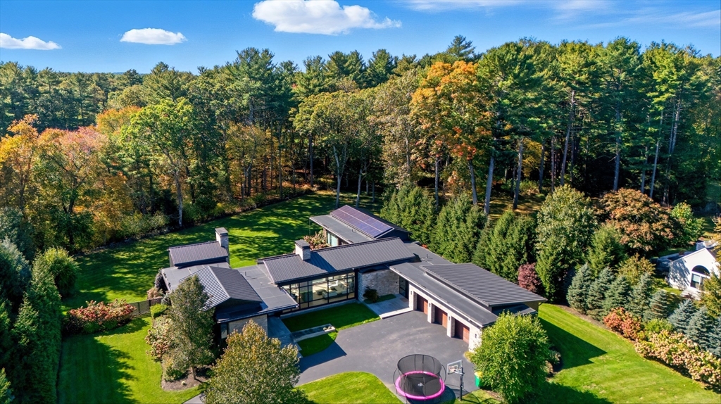 63 Sylvan Lane Weston, MA 02493 - Photo 1 of 28 an aerial view of a house with a yard