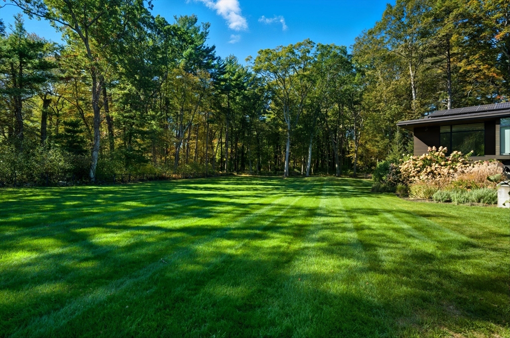 63 Sylvan Lane Weston, MA 02493 - Photo 20 of 28 a view of a backyard