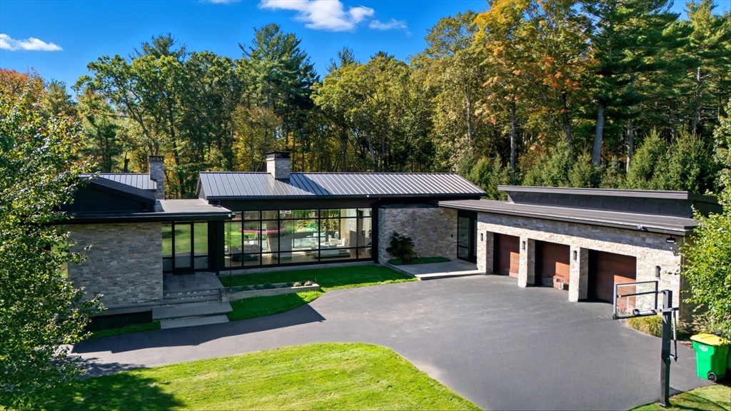 63 Sylvan Lane Weston, MA 02493 - Photo 2 of 28 a front view of a house with a yard