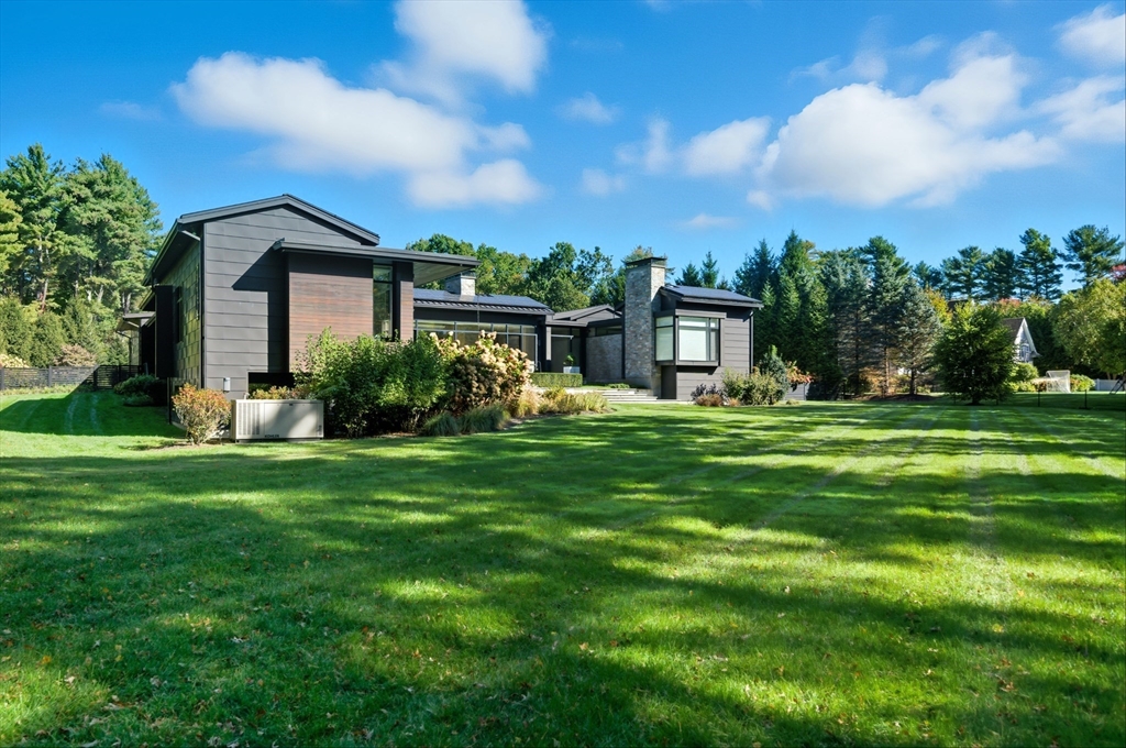 63 Sylvan Lane Weston, MA 02493 - Photo 21 of 28 a front view of a house with garden