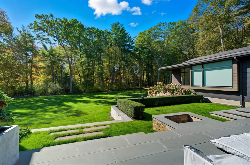 63 Sylvan Lane Weston, MA 02493 - Photo 24 of 28 a front view of a house with garden