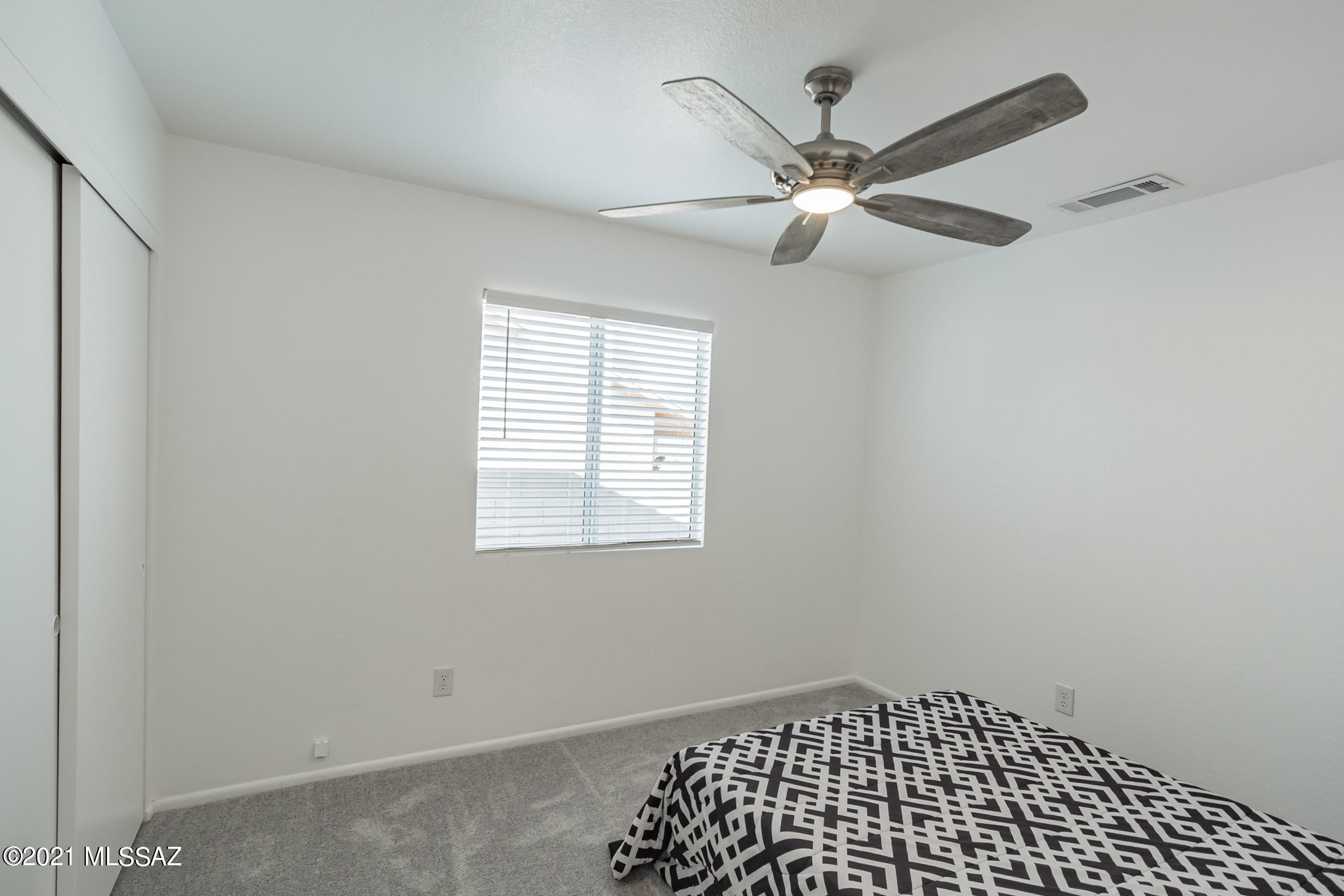 9671 East Azuma Way Tucson, AZ 85747 - Photo 21 of 31 a view of a big room with wooden floor and windows