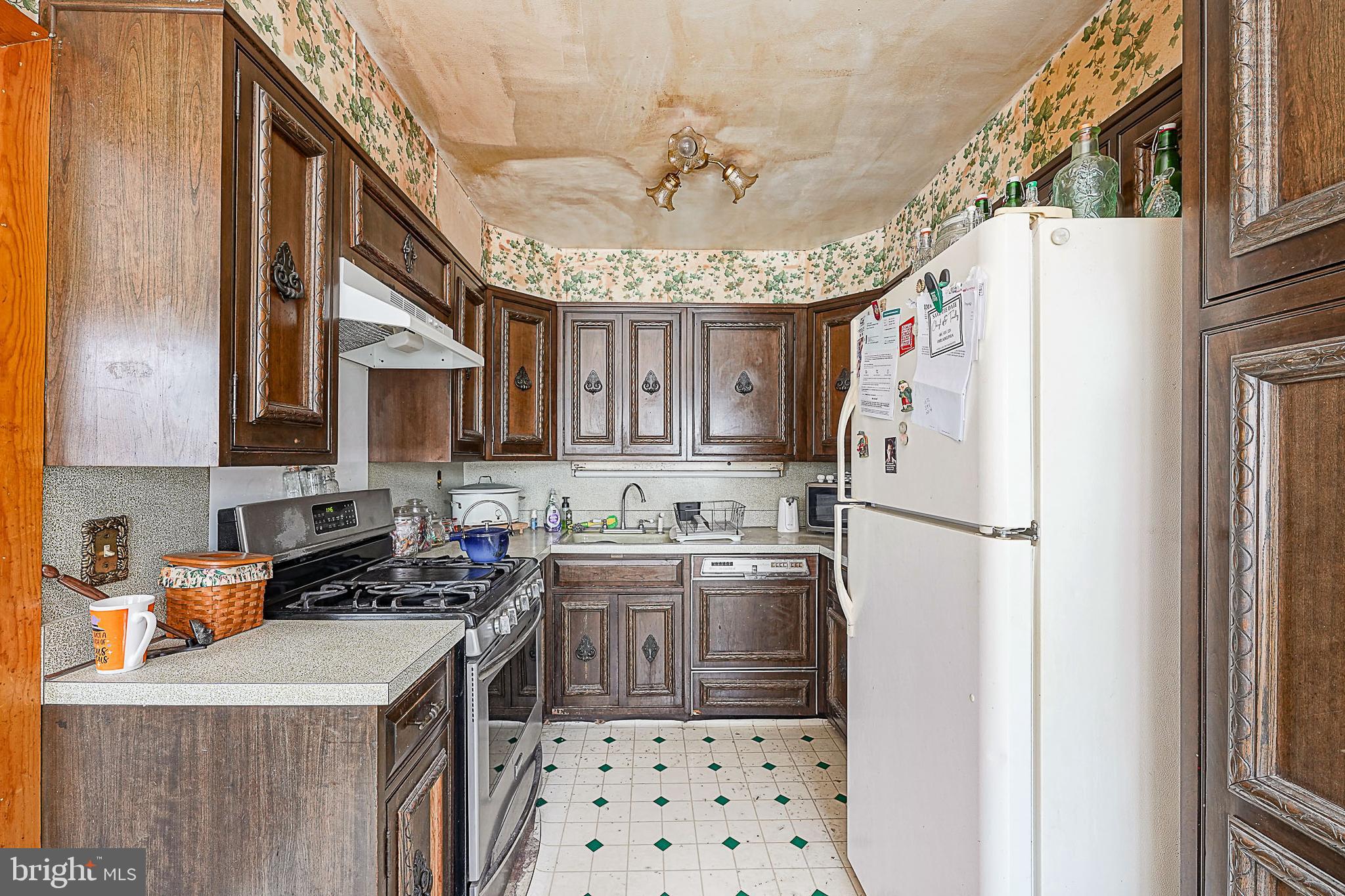 12645 Medford Road Philadelphia, PA 19154 - Photo 11 of 27 a kitchen with stainless steel appliances granite countertop a refrigerator a sink a stove and a refrigerator