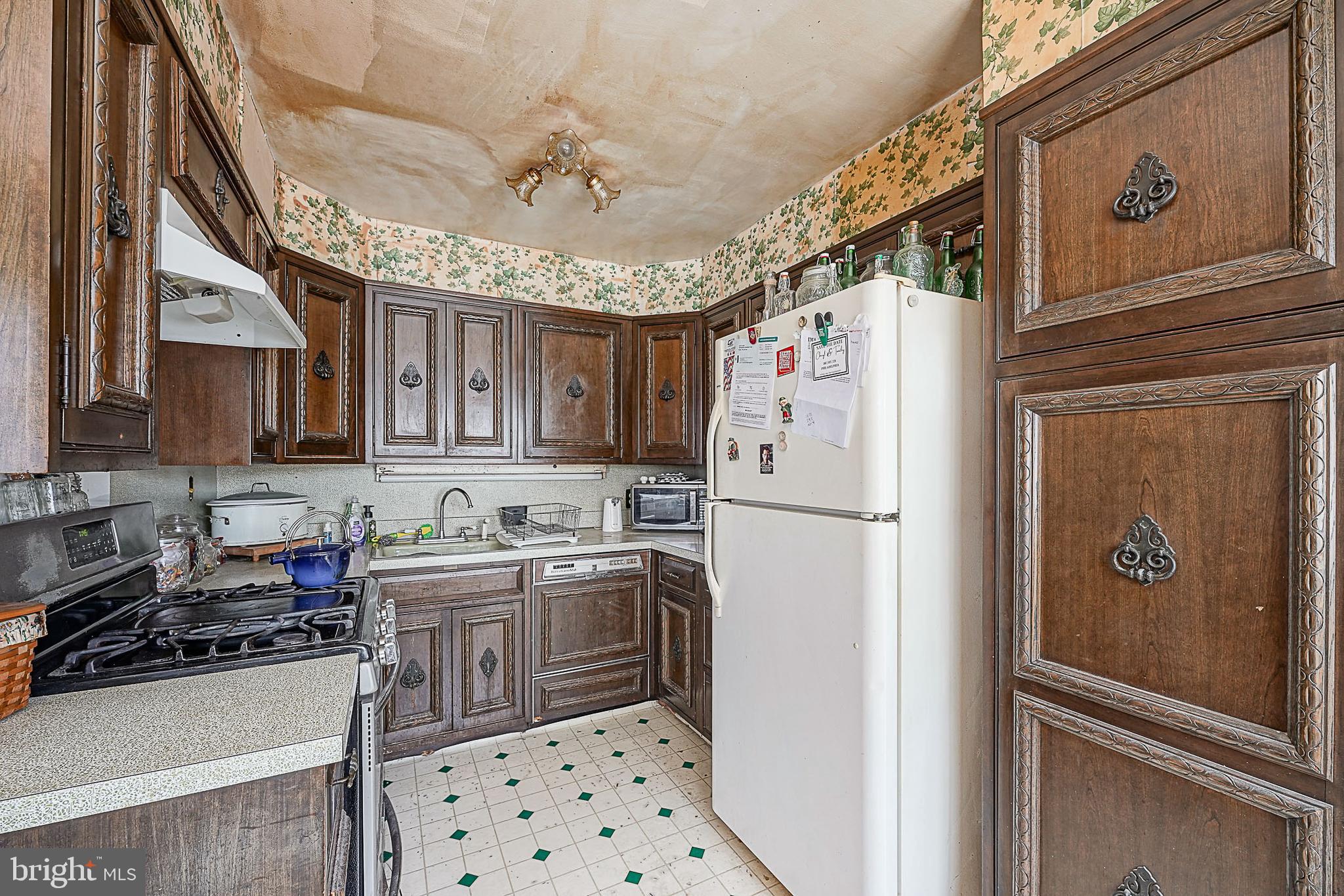 12645 Medford Road Philadelphia, PA 19154 - Photo 12 of 27 a kitchen with stainless steel appliances a refrigerator sink and cabinets