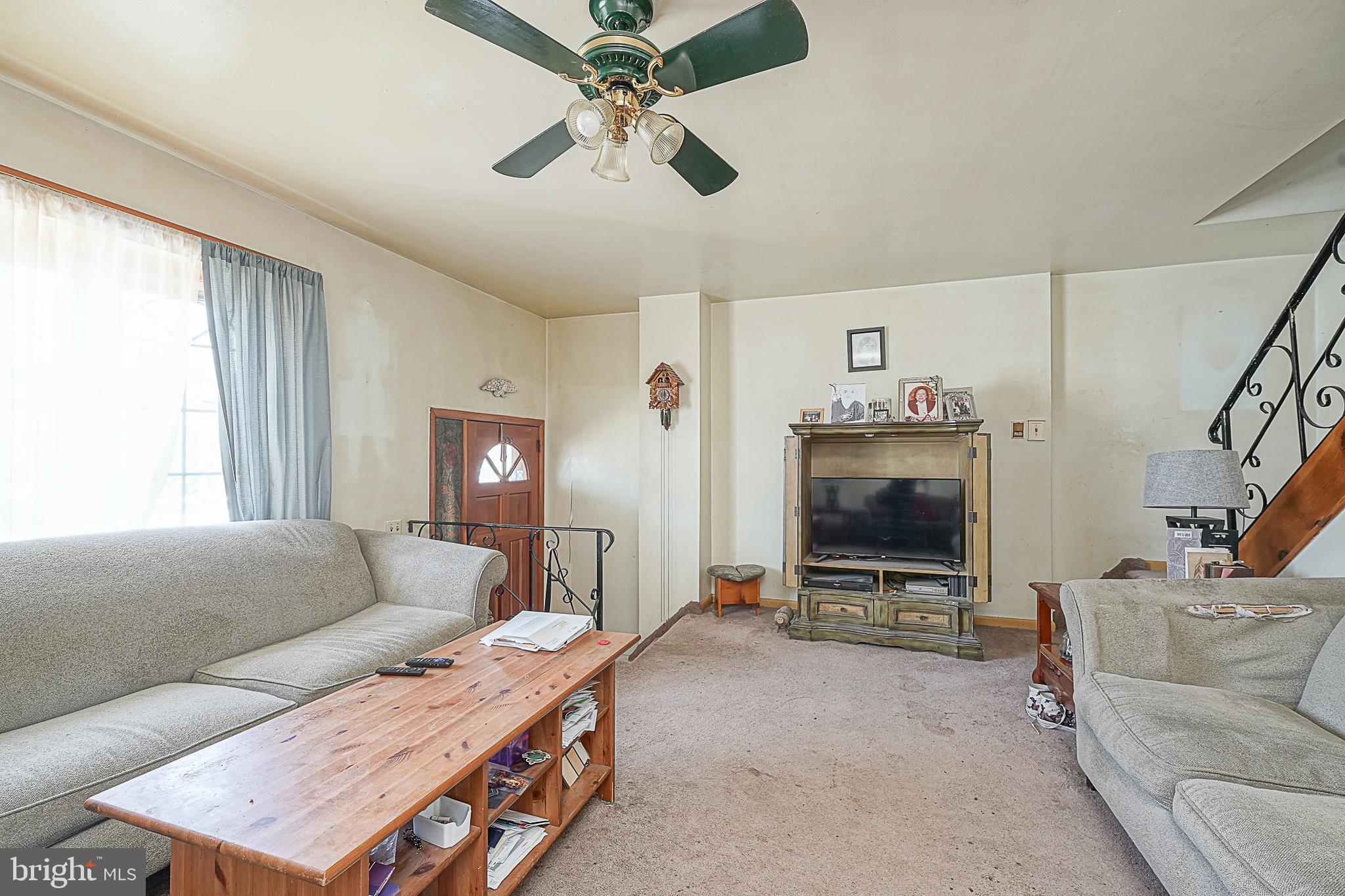 12645 Medford Road Philadelphia, PA 19154 - Photo 6 of 27 a living room with furniture and a flat screen tv