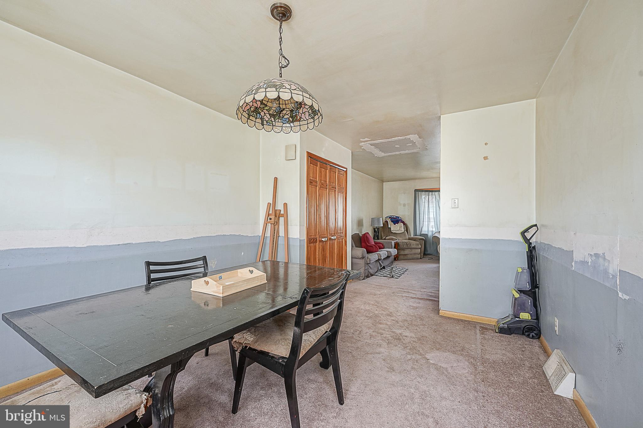 12645 Medford Road Philadelphia, PA 19154 - Photo 9 of 27 a view of a dining room with furniture and chandelier