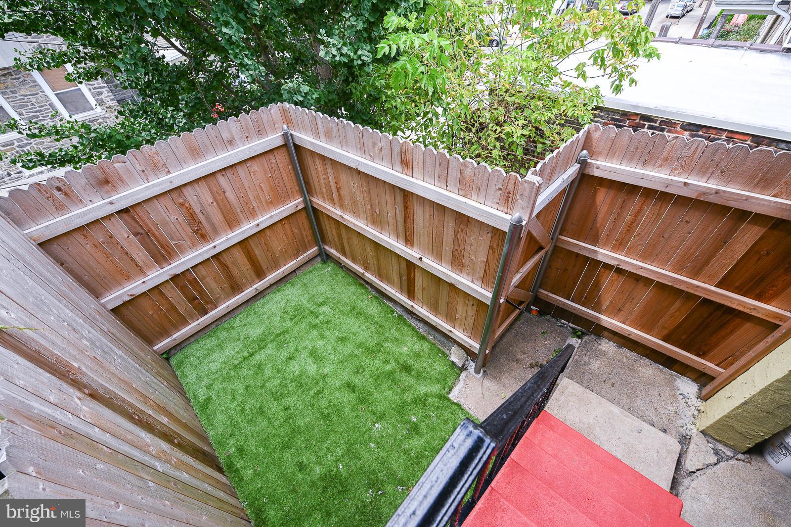 5208 Ridge Avenue Philadelphia, PA 19128 - Photo 10 of 24 Fenced in Back Yard with Artificial Turf