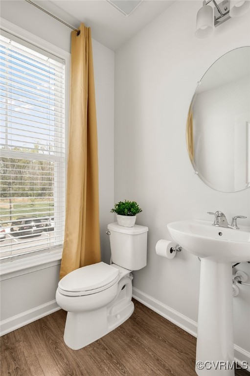 589 Rivanna Hl Road Glen Allen, VA 23060 - Photo 16 of 26 LEVEL TWO
Powder Room with a sink, toilet, wood f
