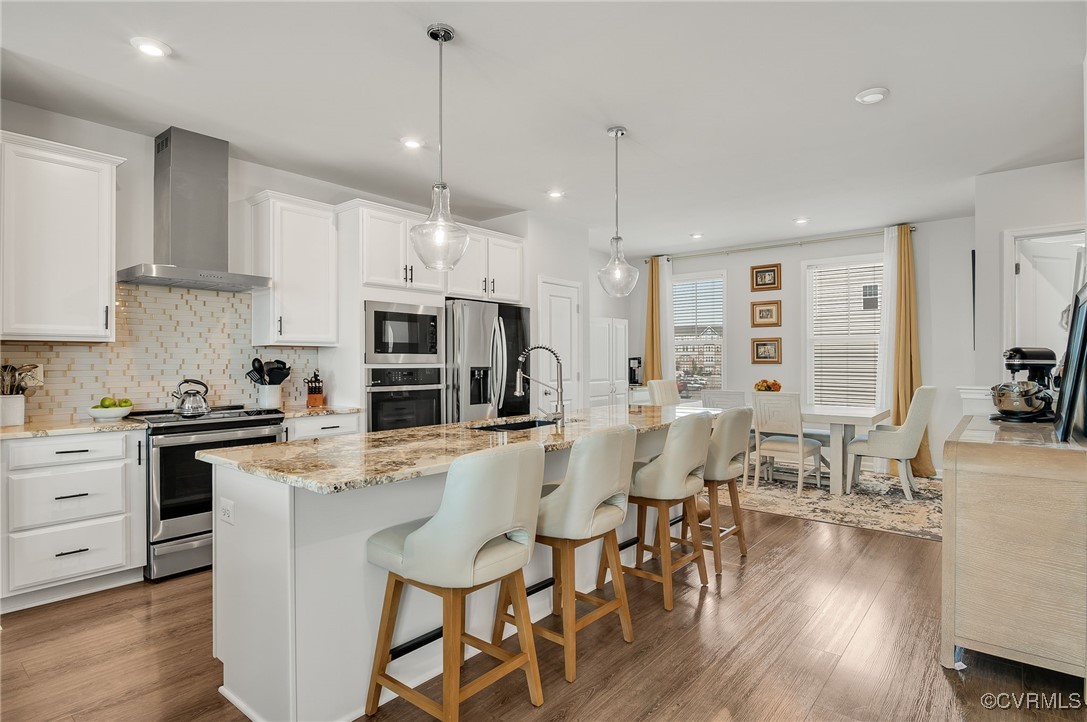 589 Rivanna Hl Road Glen Allen, VA 23060 - Photo 10 of 26 LEVEL TWO
Kitchen featuring an island with sink,