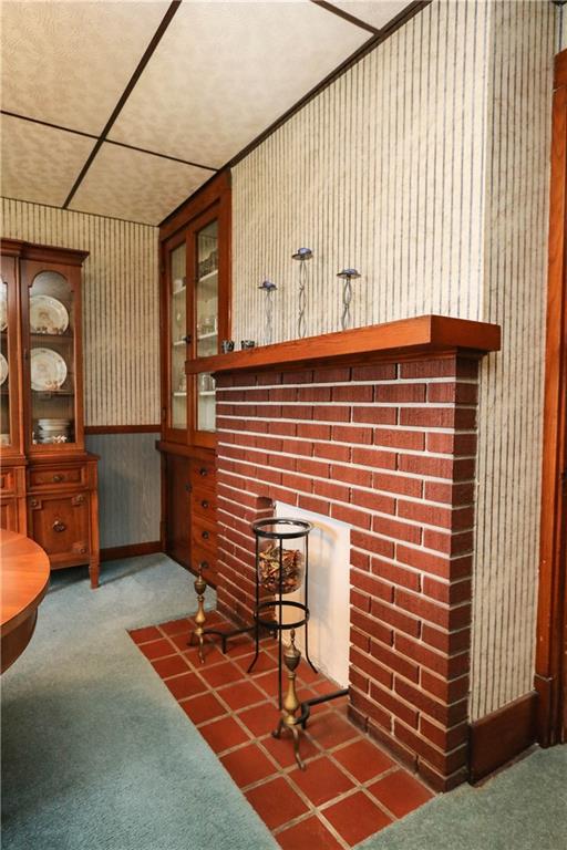 637 North Pike Road Cabot, PA 16023 - Photo 10 of 25 Dining Room has decorative fireplace & built-in china cupboard