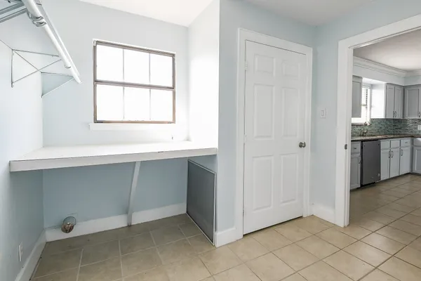 a workspace with windows and a sink