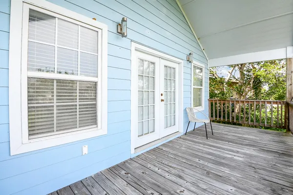 a view of a balcony with wooden floor