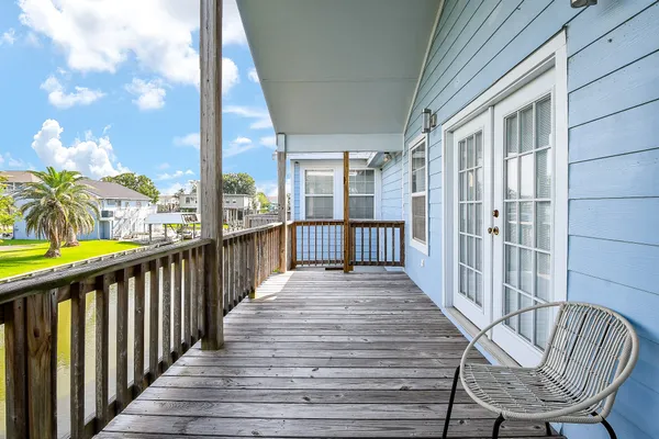 a view of a balcony with wooden floor