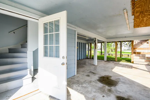 a view of a house with porch and furniture