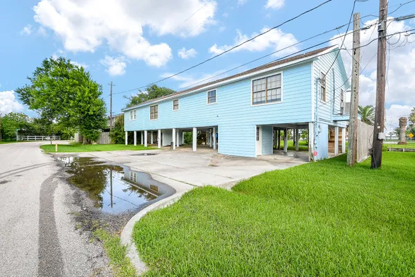 a view of a house with a yard patio and a patio