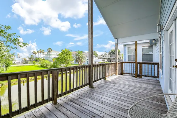 a view of a balcony with wooden floor