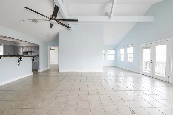 a view of a kitchen with a sink and a window